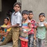 young boys lining up for food at school