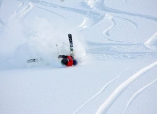 Knowing when to stop skiing and snowboarding to save yourself woman crashing ski