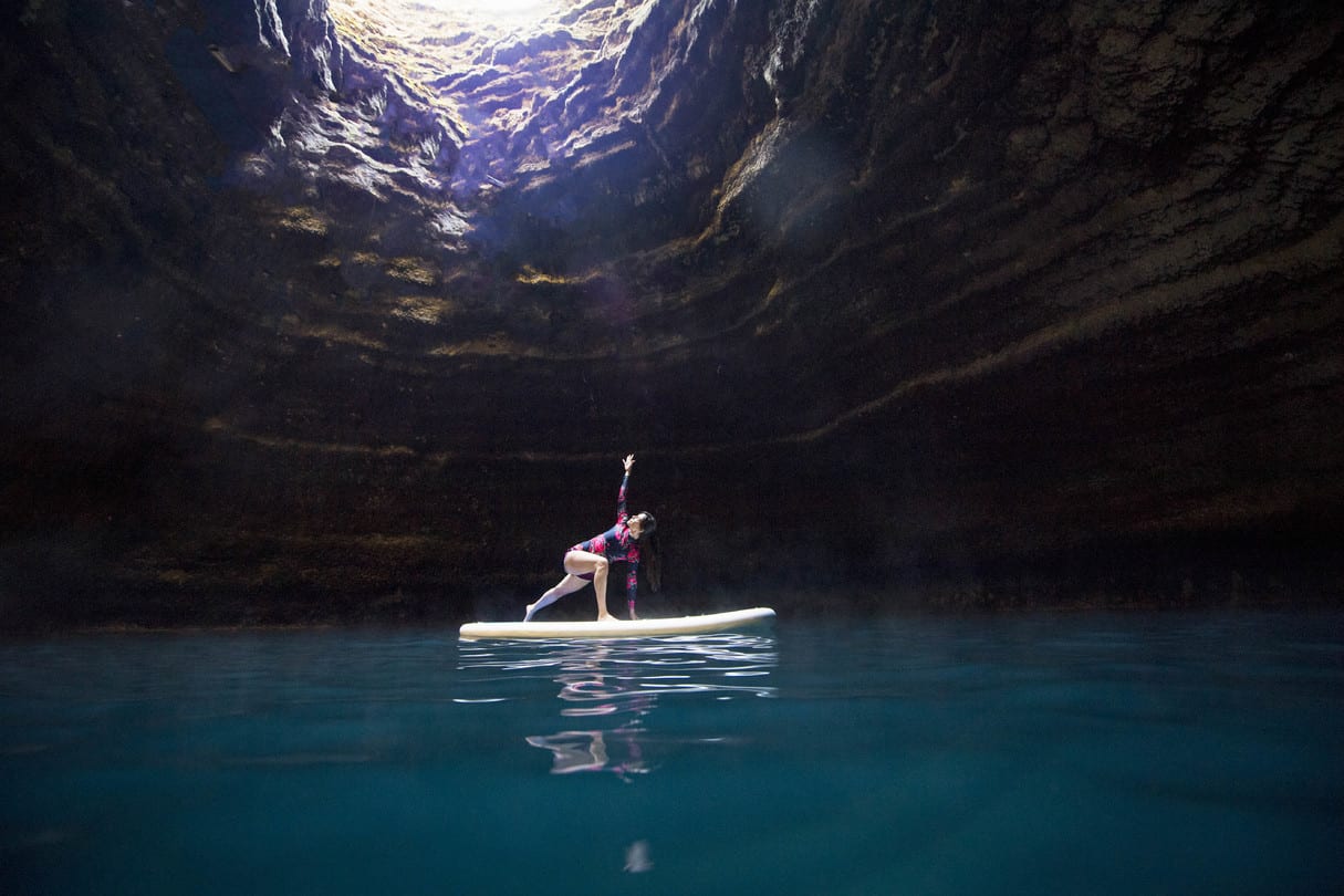 stand up paddleboard yoga in the crater