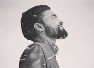 Eight easy ways to save your skin on the ski slopes canva grayscale photo of man in zip up jacket