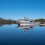 1. Odalisque cruising the mirrored waters Bathurst Harbour 2