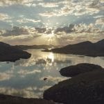 Sunset over mirrored waters with Odalisque in the foreground