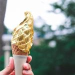 Ice,Cream,Cone,Covered,With,Real,Gold,Leaf,Held,By
