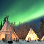 HERO-Aurora-Village-Yellowknife-Northwest-Territories-Canada-Aurora-Borealis-Northern-Lights-Winter-Three-Teepees-Landscape-Green-wonderland-Hero-500k (1)