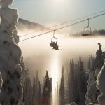 Skiers on the chairlift at Red Mountain Resort